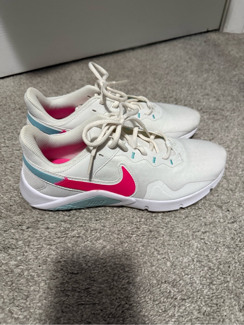 Nike White Sneakers with Pink Swoosh and Light Blue Accents
